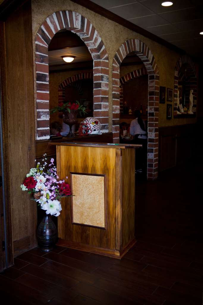 Hostess stand in use at Italian restaurant.