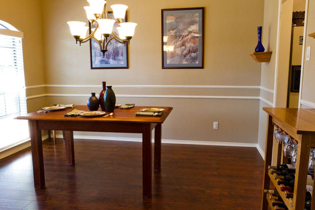 Dining room with wood table and wood wine cabinet